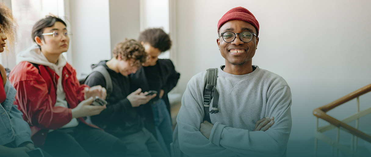 Smiling international student in a hallway